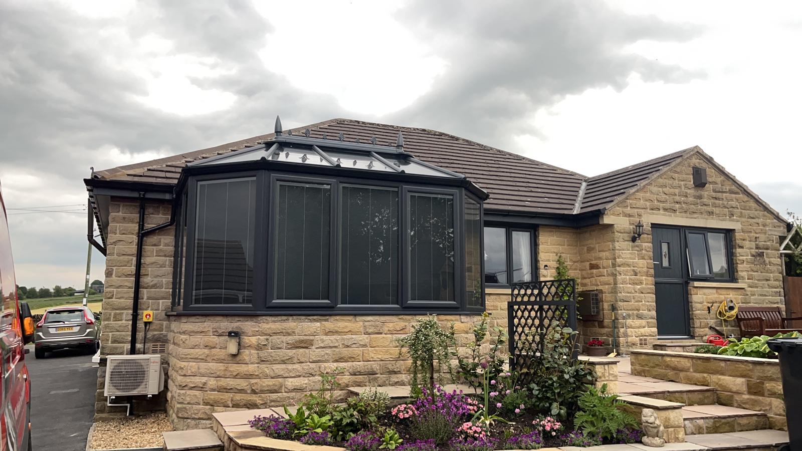 Anthracite grey conservatory windows and doors with integrated blinds
