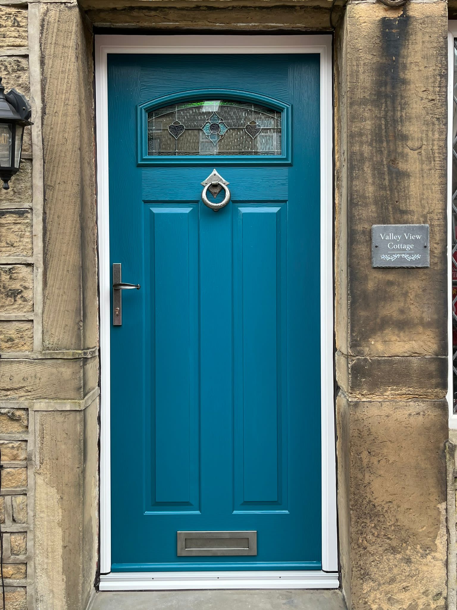 London composite door in Peacock Blue with Dorchester glass and pewter accessories
