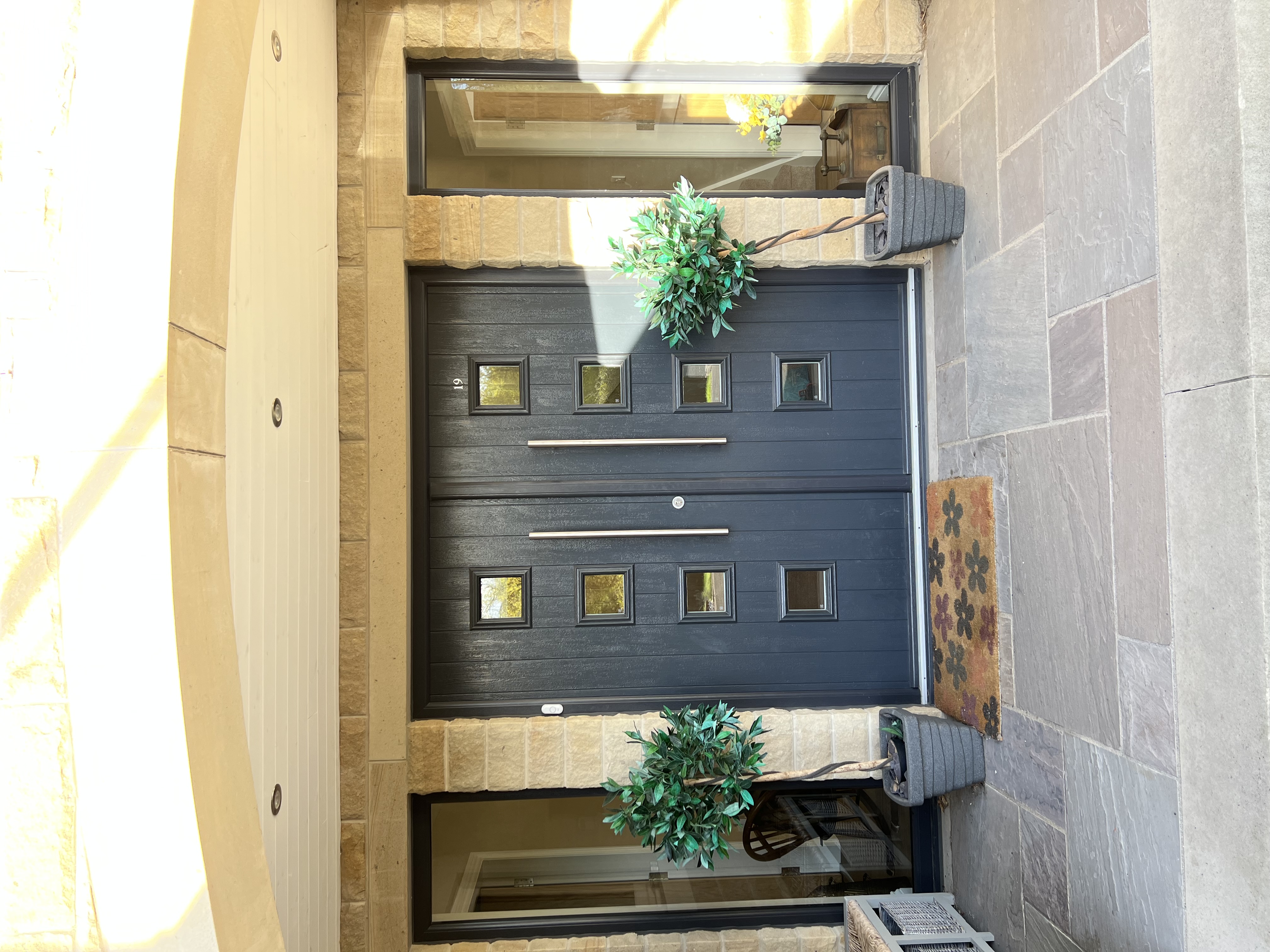 Parma composite French doors in Anthracite Grey with long bar handles