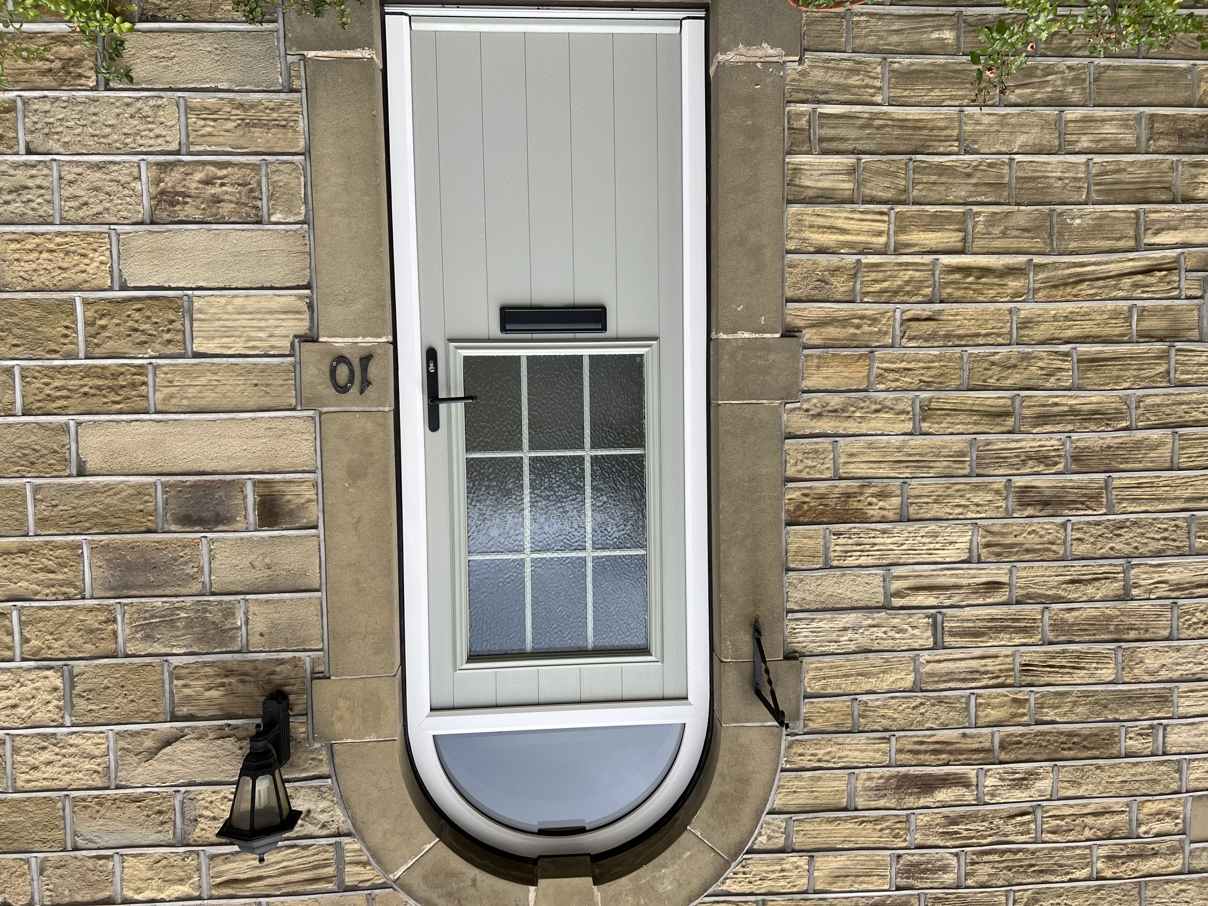 Bespoke arched Beeston composite door in Painswick