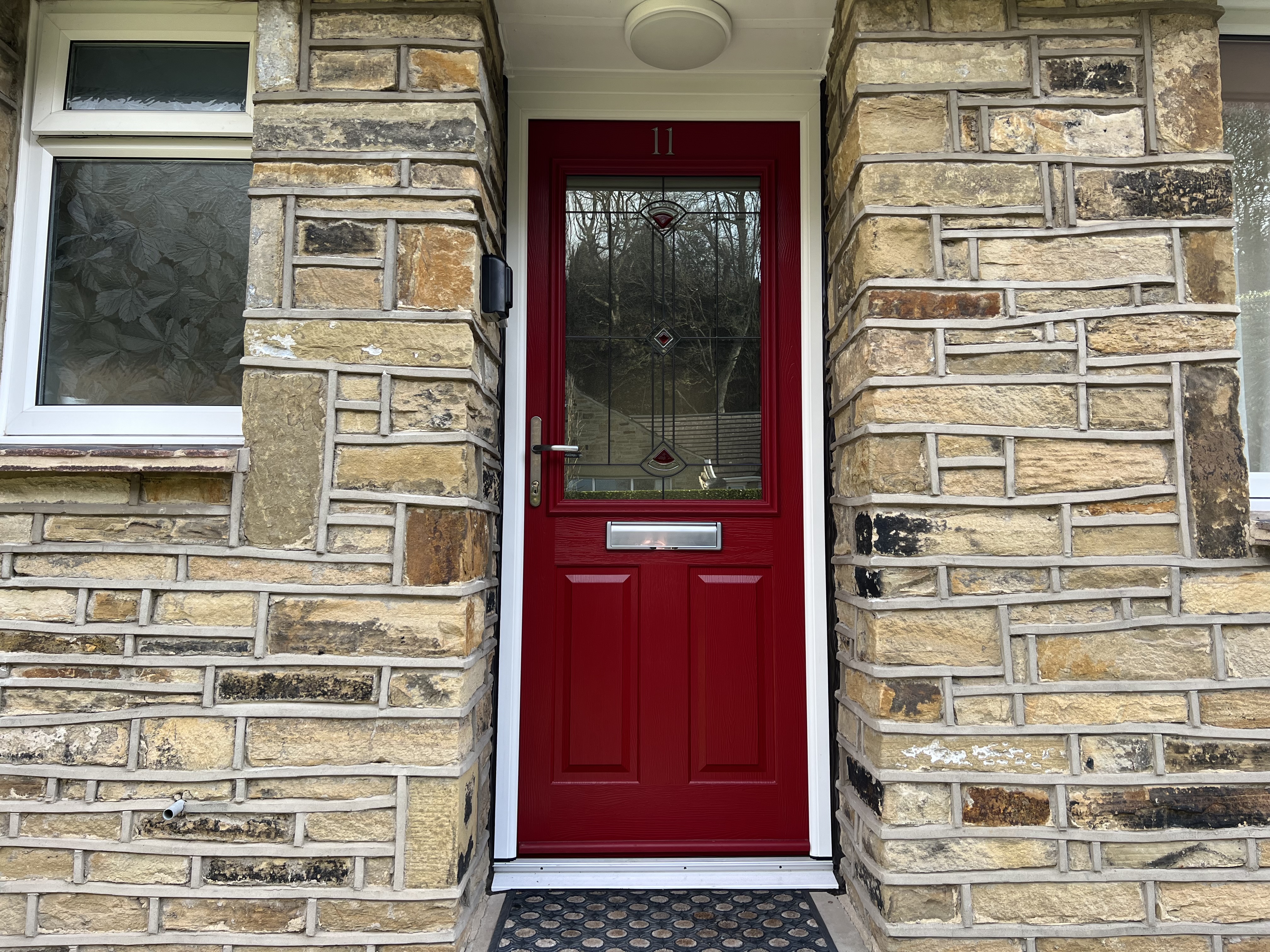 Beeston composite door in Ruby Red with Quad Red glass