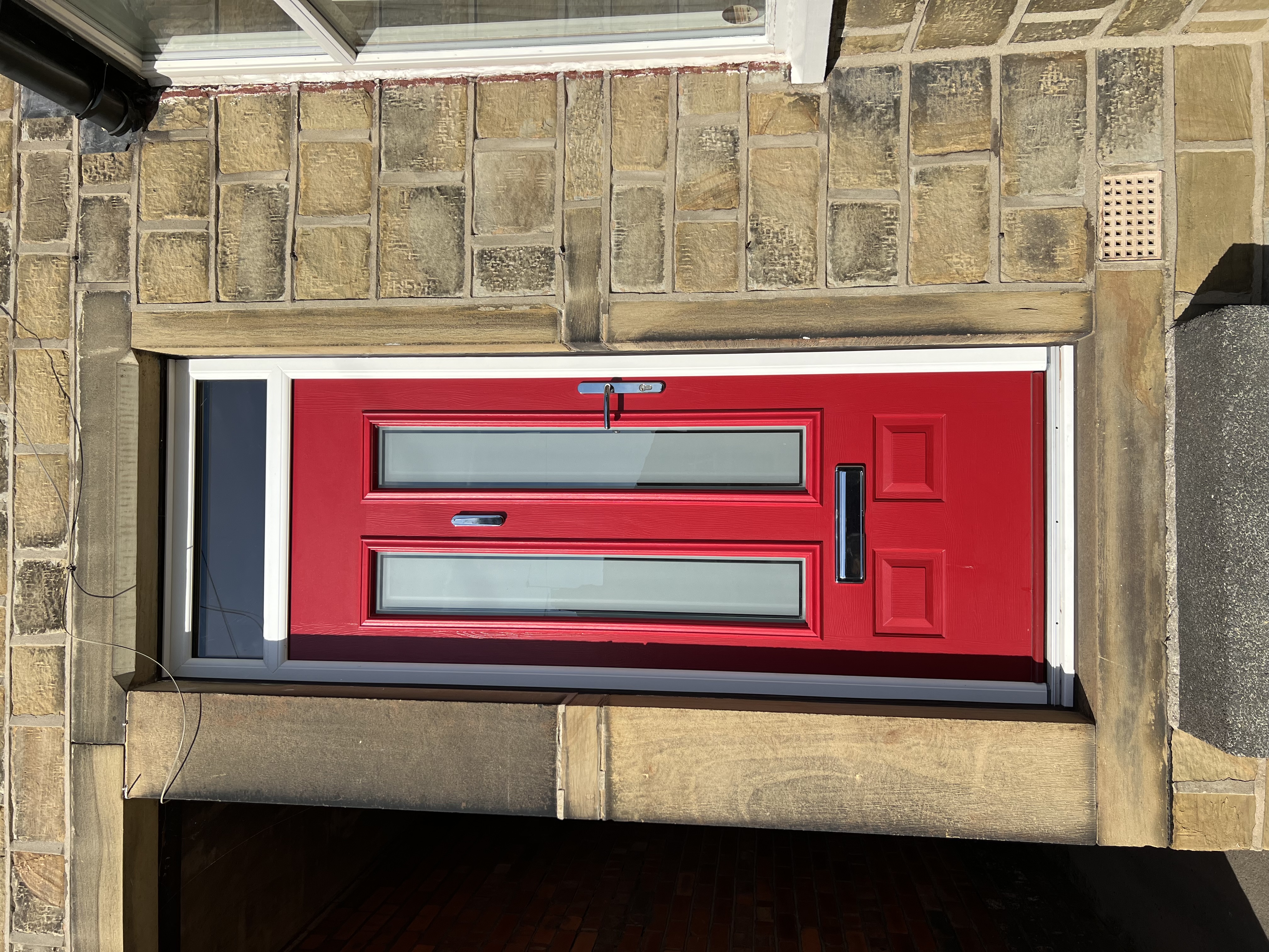 Edinburgh composite door in Ruby Red with Victorian border glass