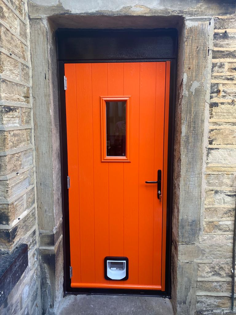 Flint 2 composite door in Tangerine with cat flap