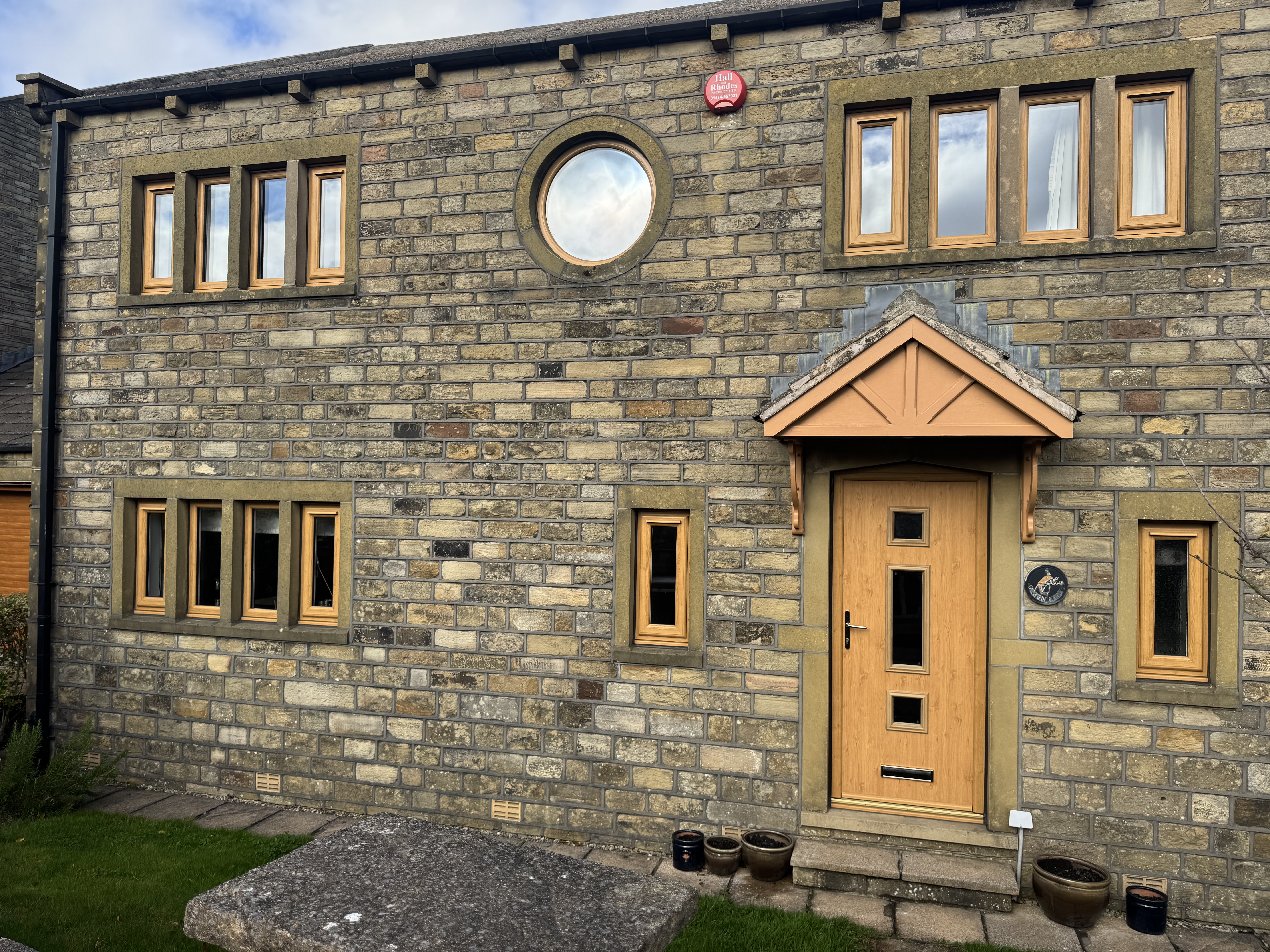 Irish Oak uPVC windows including one porthole window, with clear glass and trickle vents