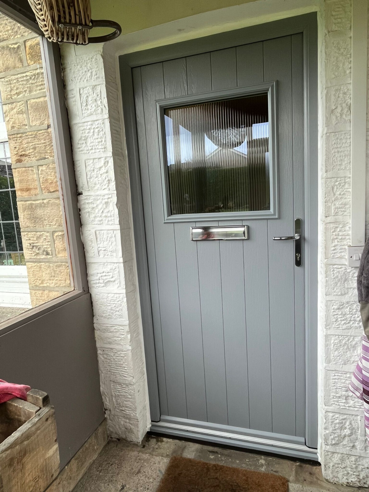 French Grey Trieste composite door with fluted glass and chrome furnishings