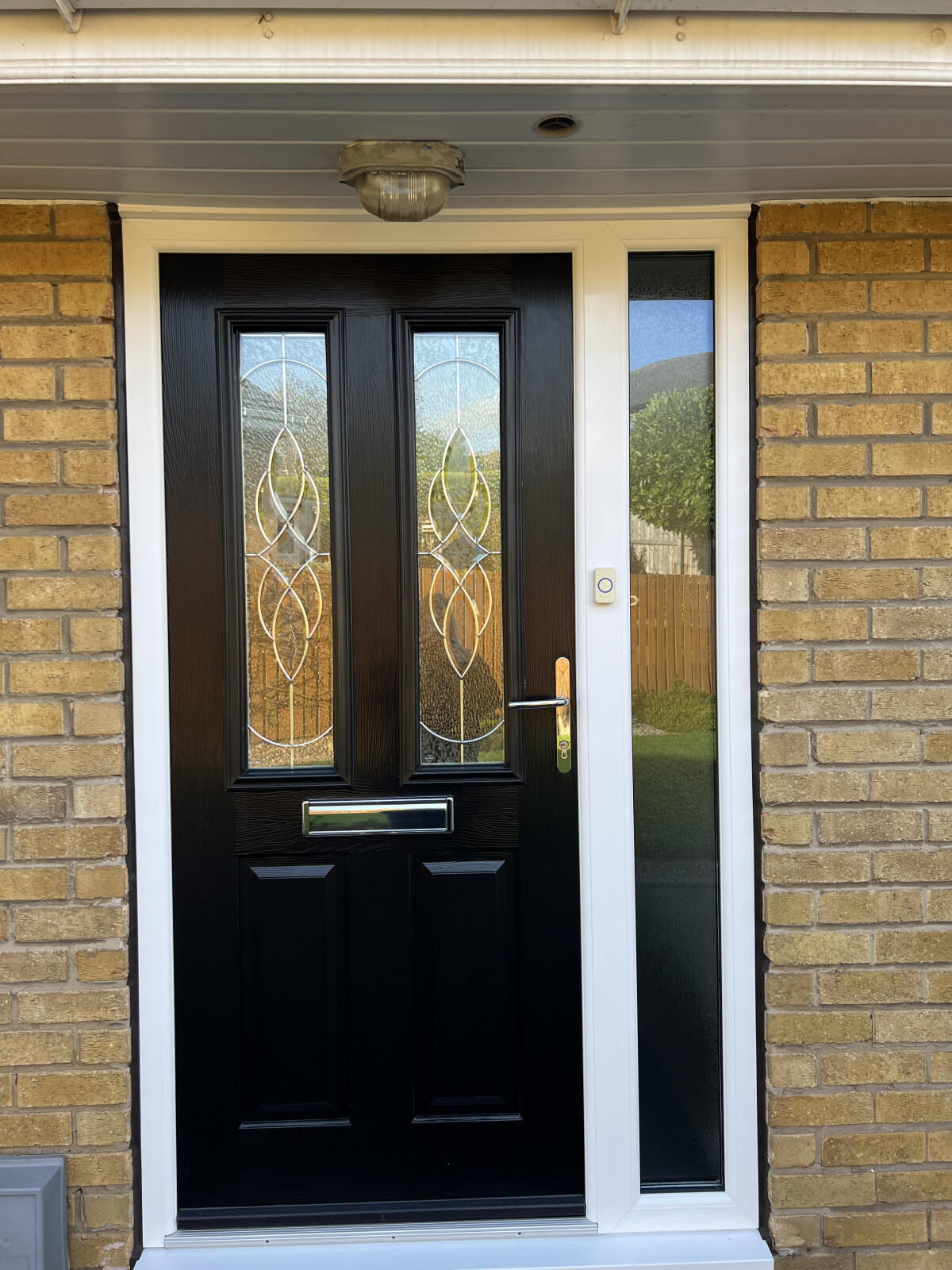 Black and white Ludlow composite door with elegance glass