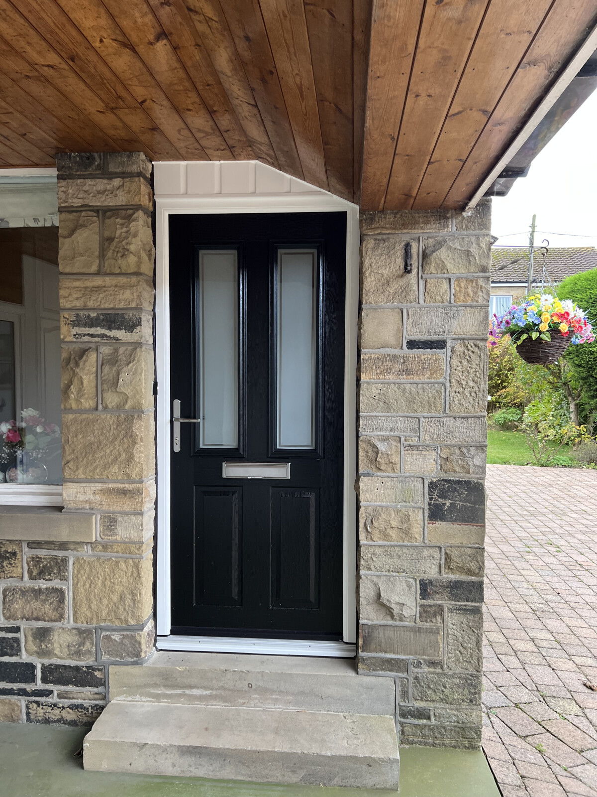 Black Ludlow composite door with Victorian border glass