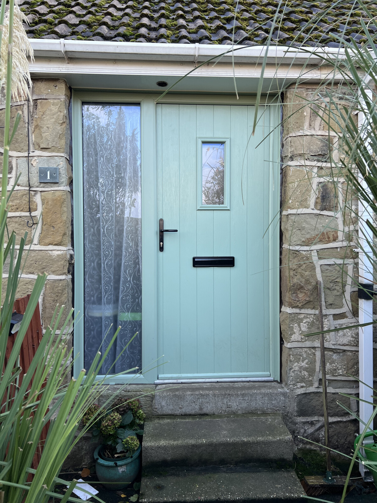 Flint 2 composite door in Chartwell Green with clear glass
