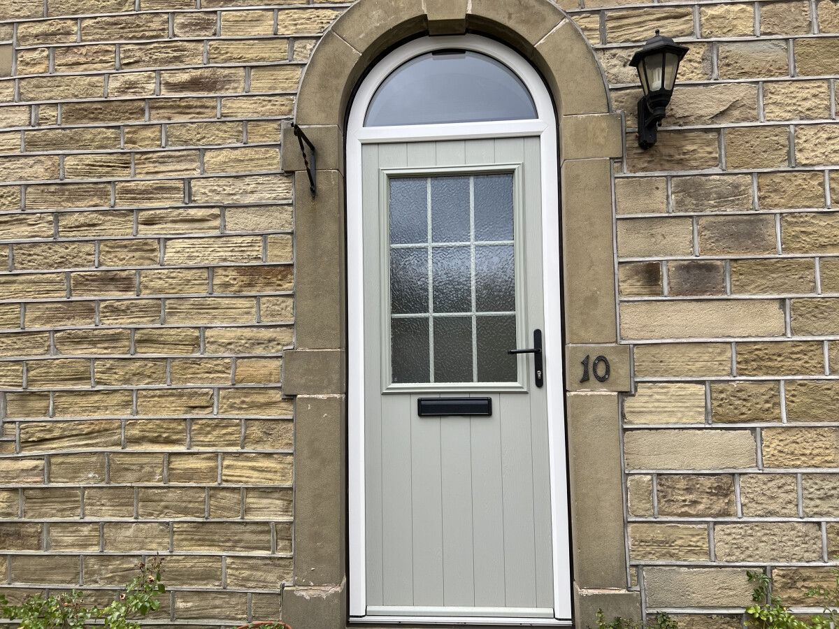 Bespoke arched Beeston composite door in Painswick