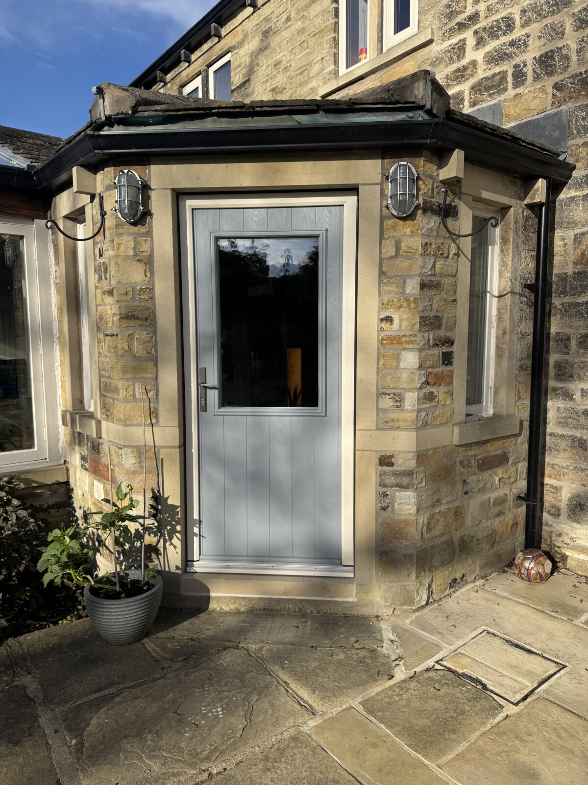 French Grey Beeston Flint composite door with Cream frame with Avon pewter handle