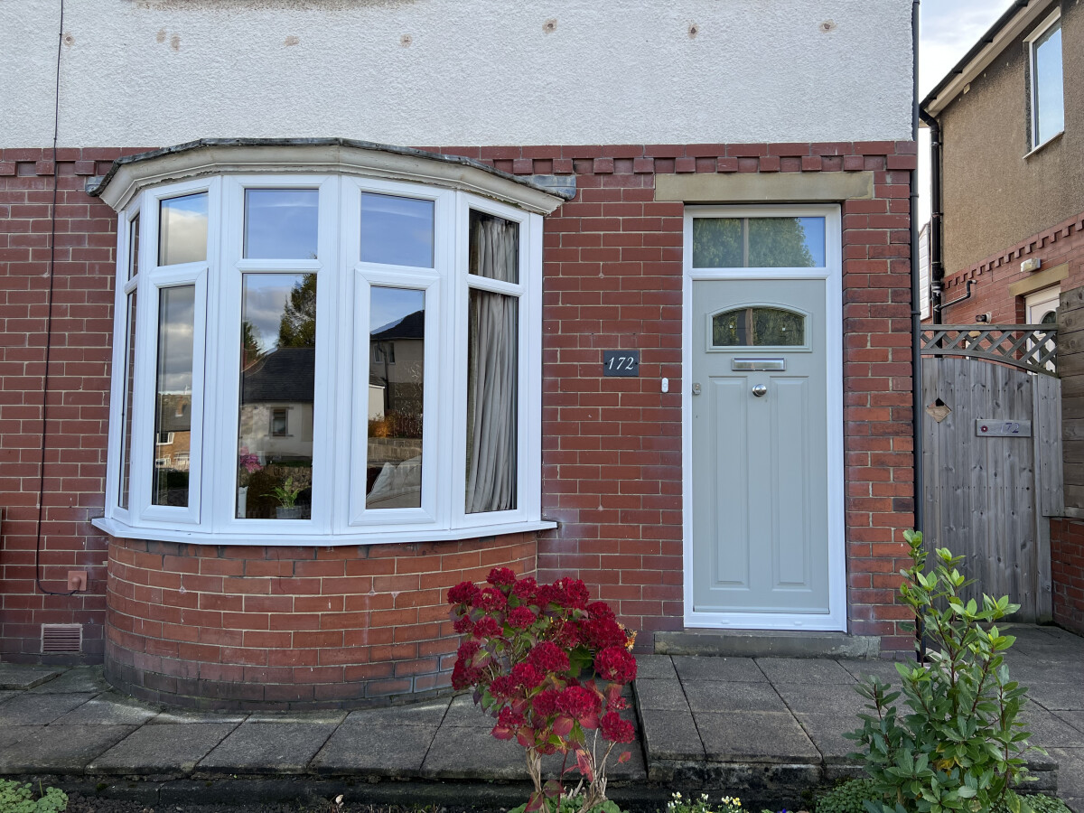 London composite door in Painswick with Caledonian glass and top light