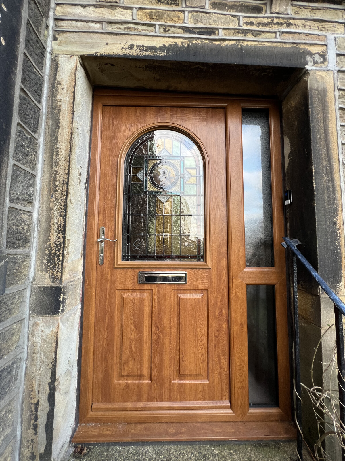 Stafford composite door in Oak with bespoke glass