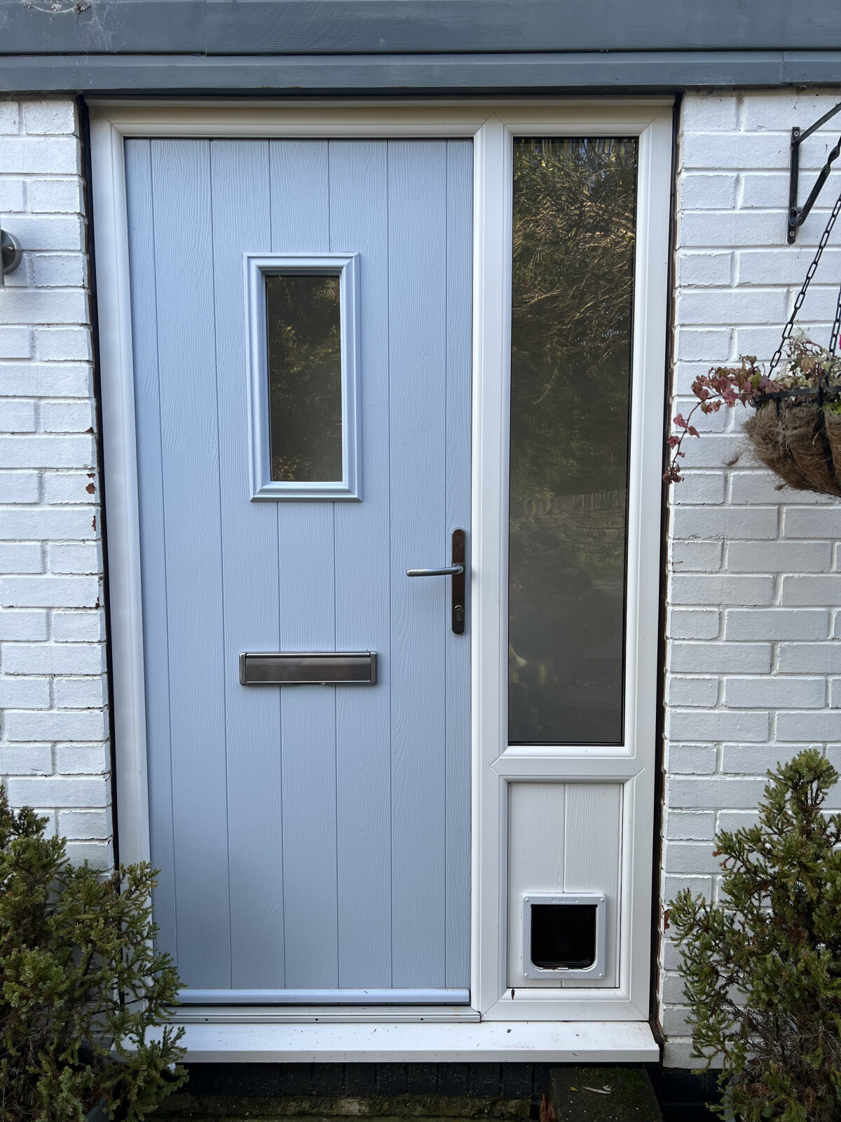 Flint 2 composite door in Duck Egg Blue with White frame and integrated cat flap