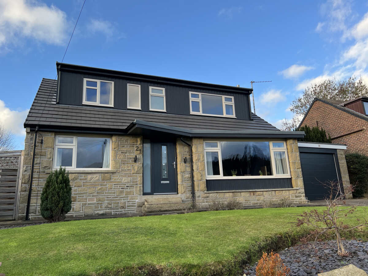 Cream uPVC windows and anthracite grey composite door