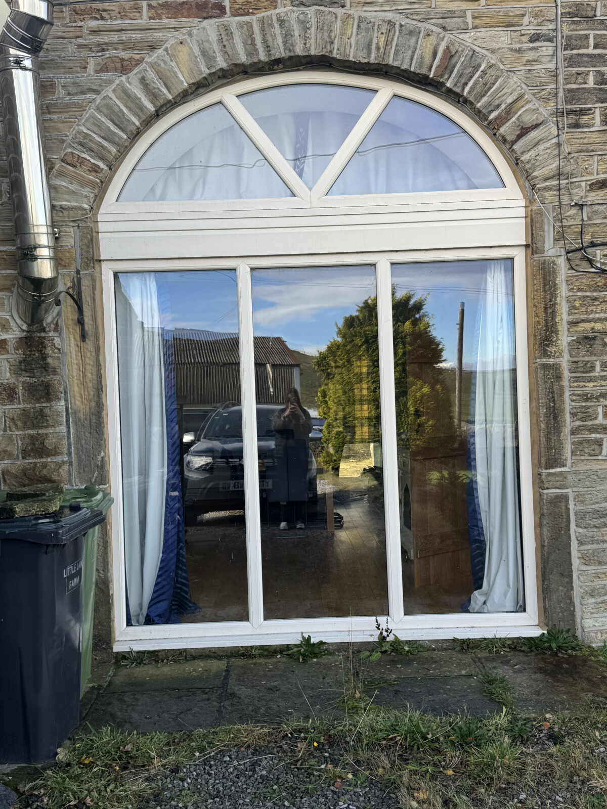 Cream uPVC arched window with clear glass